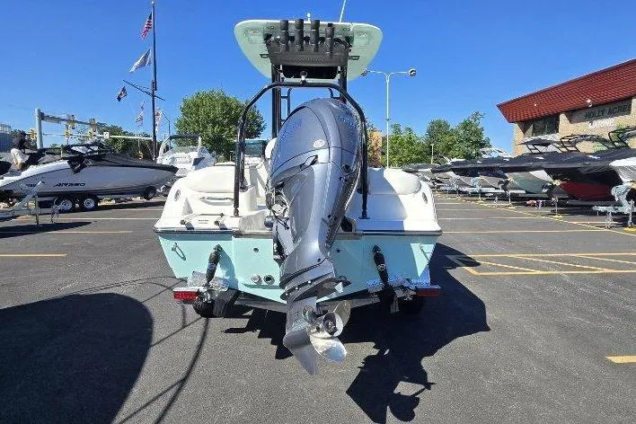 Slide: The Image of 2026 Key West 203 FS boat with outboard motor in a sunny marina. - 3