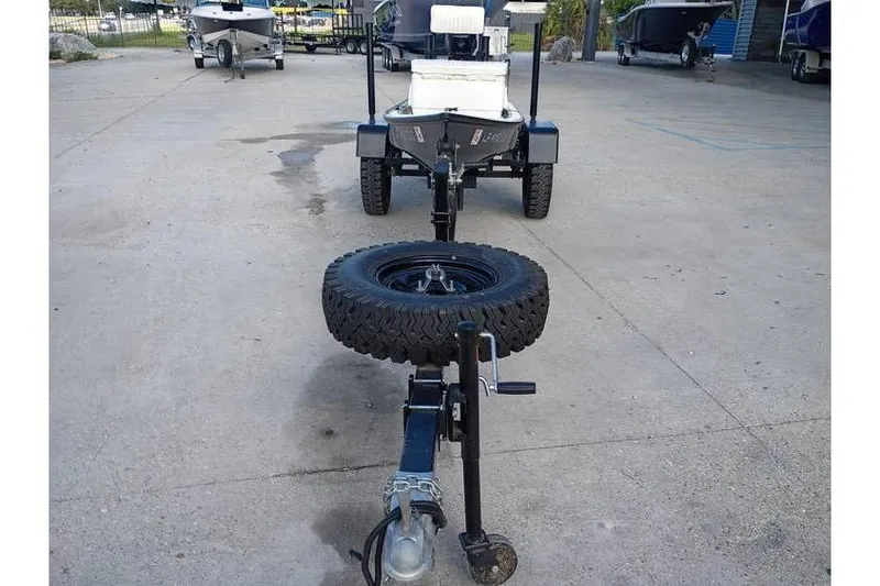 Slide: The Image of Fishfinder mounted on a Pelican Ambush 2013 boat, with cup holders and storage. - 10