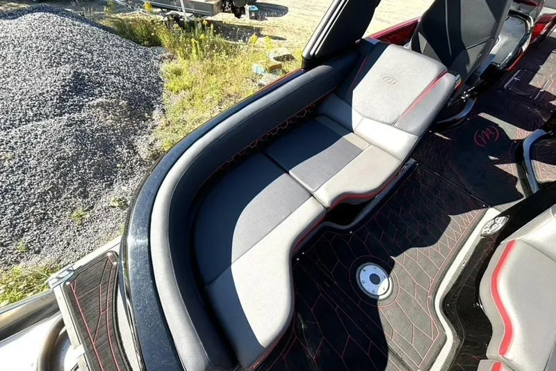 Slide: The Image of Luxurious seating on 2022 Manitou XT 27 SRW boat, featuring sleek design and premium materials. - 14