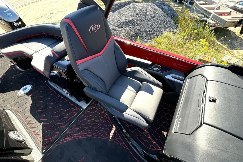 Slide: The Image of 2022 Manitou XT 27 SRW boat interior with sleek seating and modern design. - 17