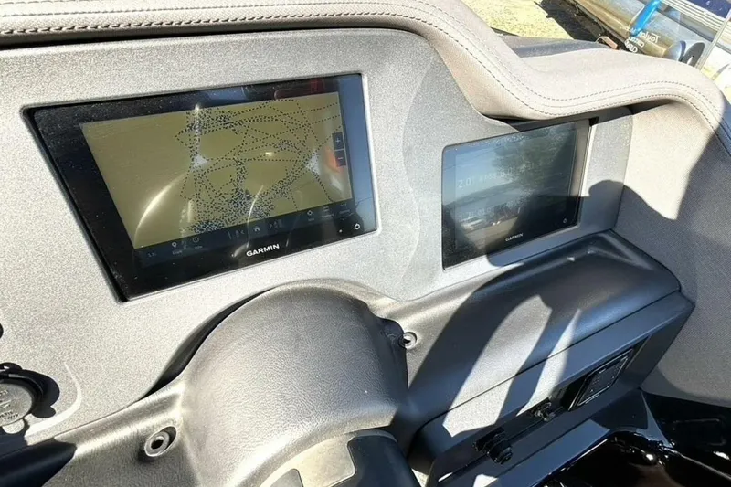 Slide: The Image of Dashboard of 2022 Manitou XT 27 SRW with Garmin navigation displays. - 21