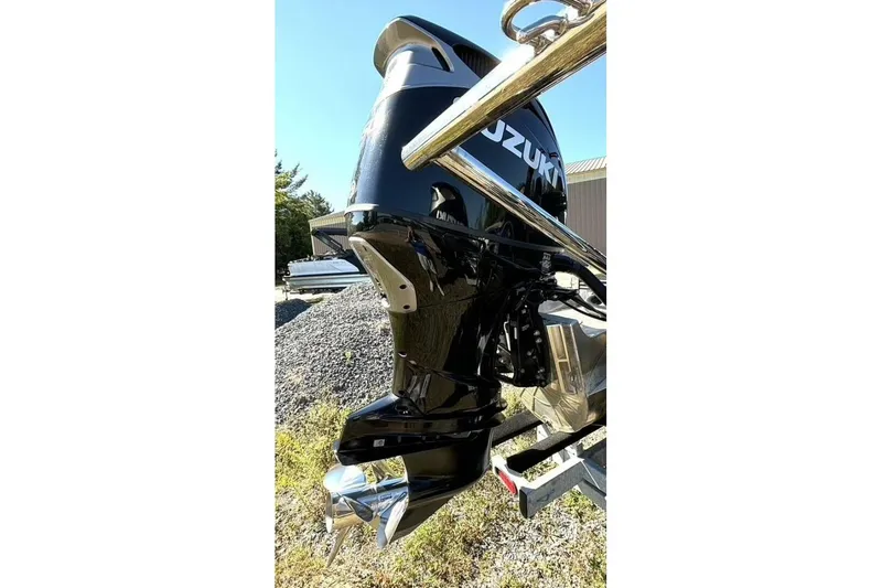 Slide: The Image of 2022 Manitou XT 27 SRW with Suzuki outboard motor, parked outdoors. - 39