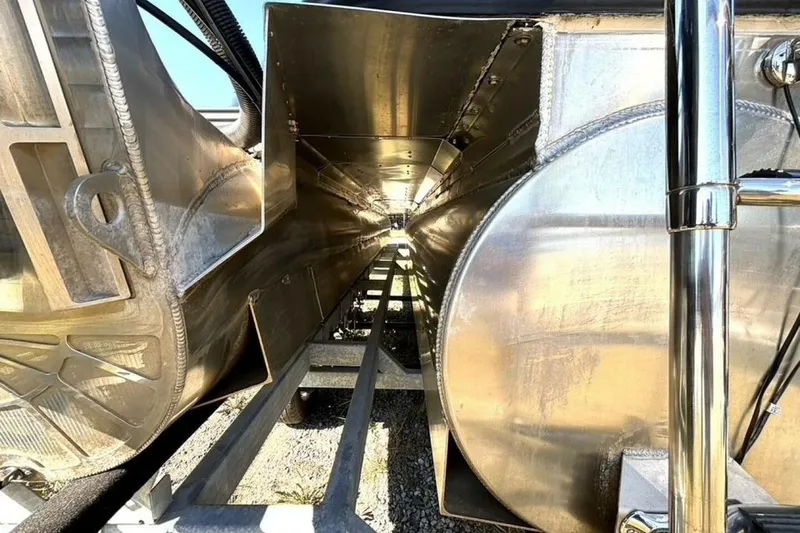 Slide: The Image of 2022 Manitou XT 27 SRW boat underside, showcasing metallic structure and components. - 42