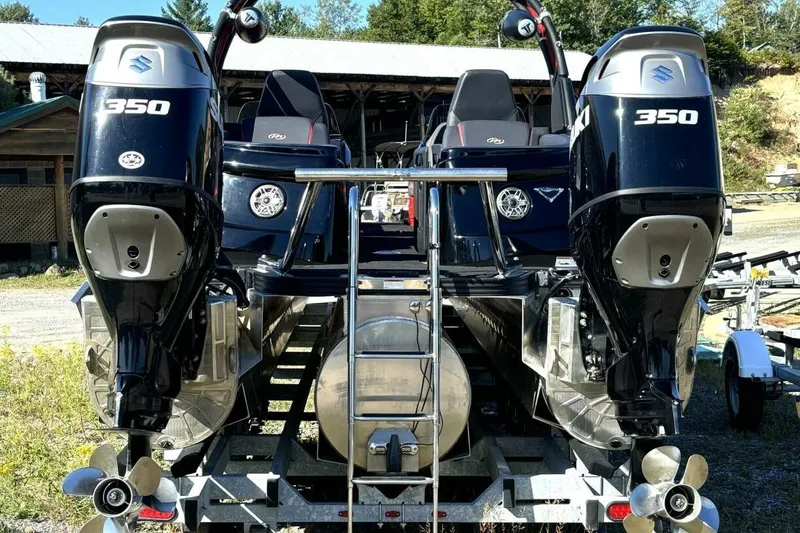 Slide: The Image of 2022 Manitou XT 27 SRW boat with dual Suzuki 350 outboard engines. - 7
