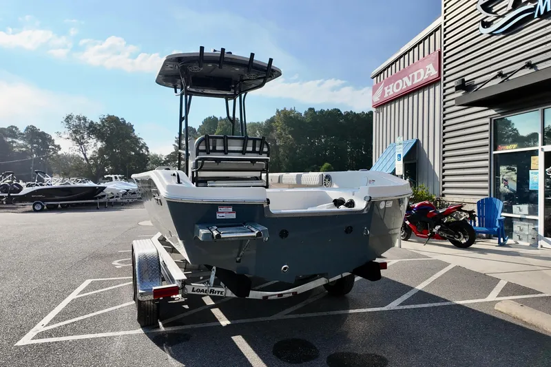 Slide: The Image of 2026 Carolina Skiff 24 Ultra Elite boat on trailer outside dealership. - 3