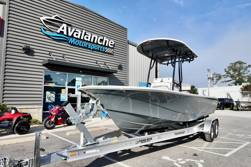 Slide: The Image of 2026 Carolina Skiff 24 Ultra Elite boat on trailer at Avalanche Motorsports dealership. - 5