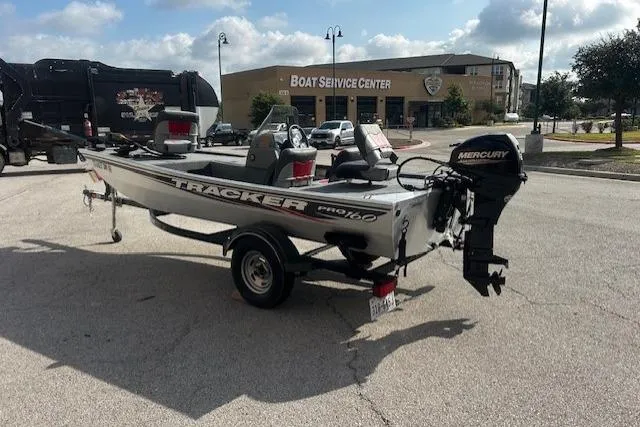 Slide: The Image of 2016 Tracker Pro 160 boat on trailer near boat service center. - 4