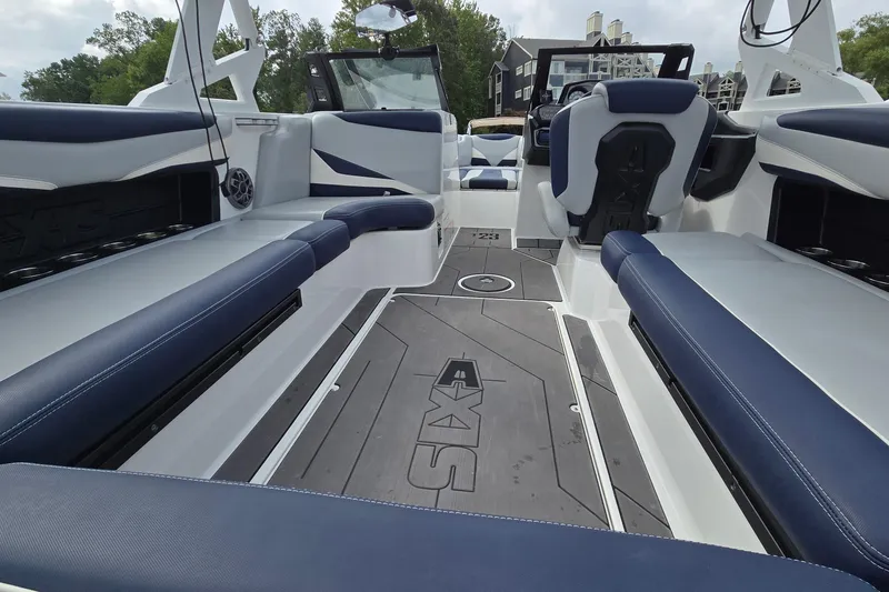 Slide: The Image of Interior of 2019 Axis T23 boat with blue and white seating and modern design. - 20