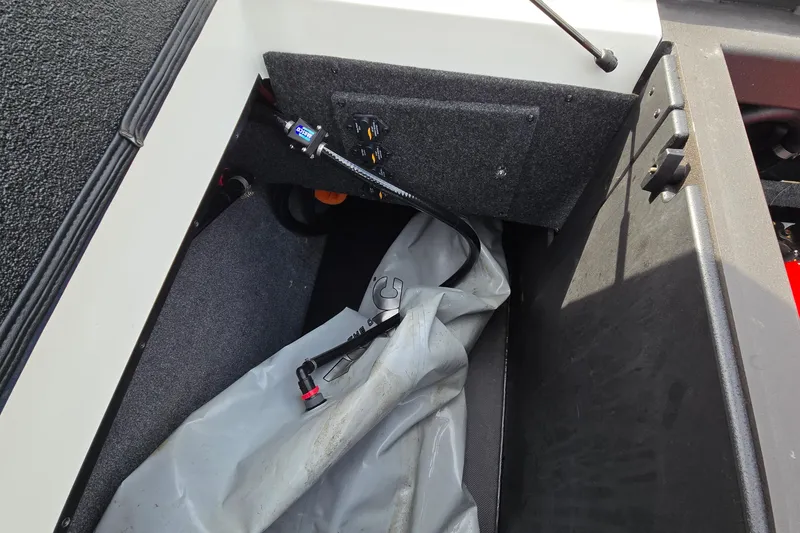 Slide: The Image of 2019 Axis T23 boat interior storage compartment with equipment and wiring. - 30