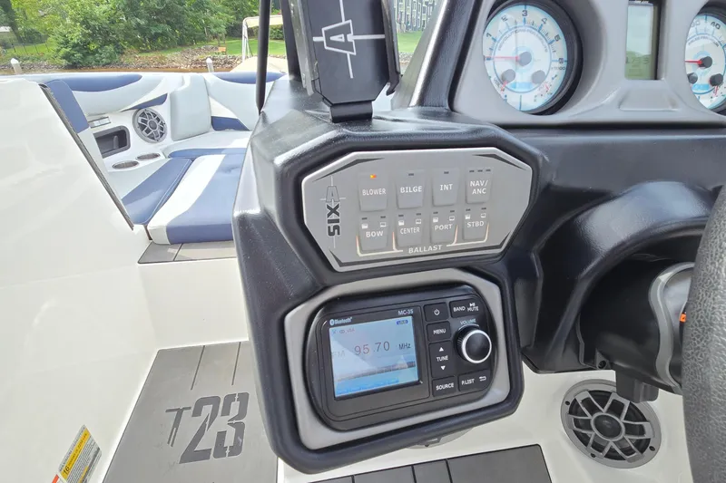 Slide: The Image of Control panel of a 2019 Axis T23 boat with audio system and gauges. - 34