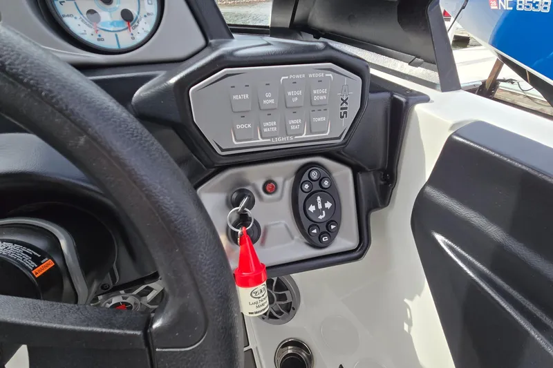 Slide: The Image of Dashboard of a 2019 Axis T23 boat with control panel and key ignition. - 35