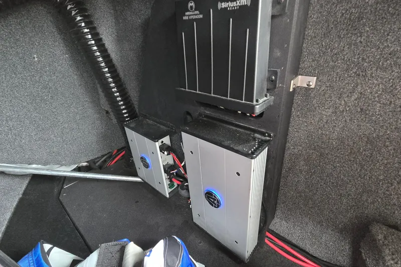 Slide: The Image of 2019 Axis T23 interior showing audio system components and wiring setup. - 38