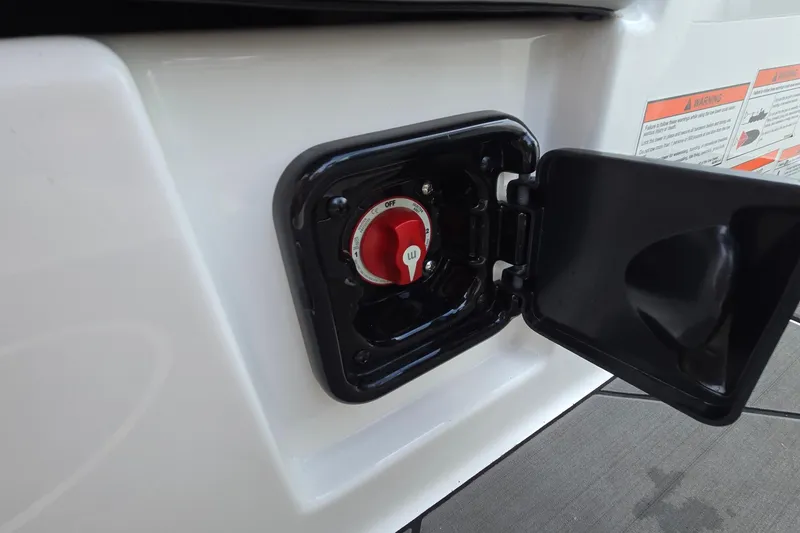 Slide: The Image of 2019 Axis T23 boat battery switch with open cover and warning labels. - 39