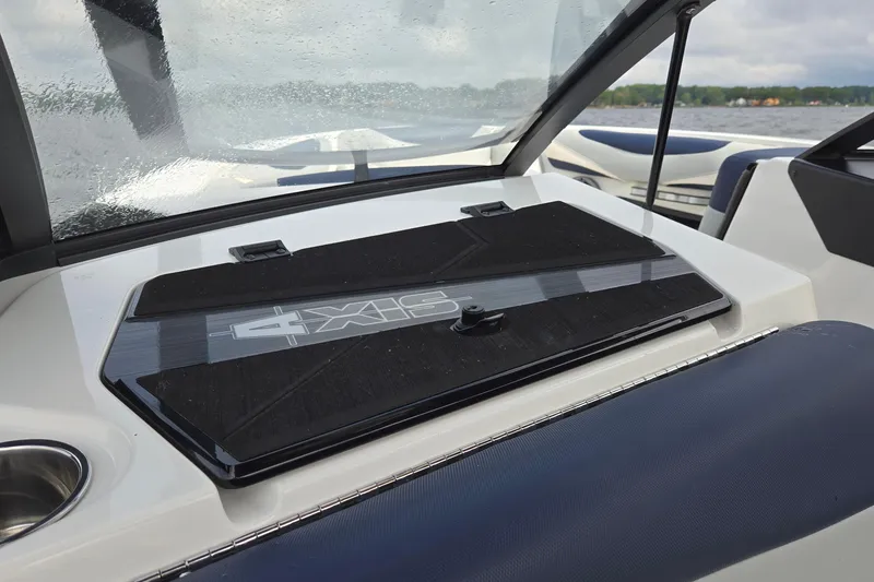 Slide: The Image of 2019 Axis T23 boat dashboard with sleek design and windshield view. - 47
