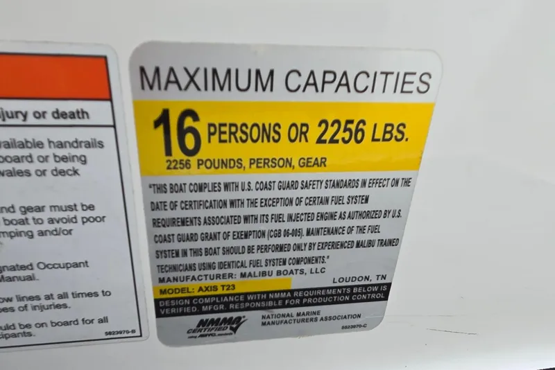 Slide: The Image of 2019 Axis T23 boat capacity label: 16 persons or 2256 lbs, safety compliance details. - 49