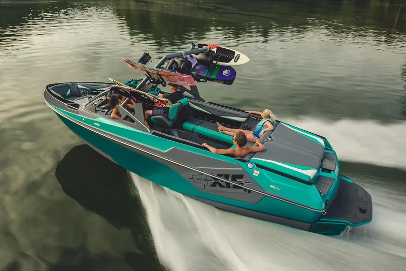 Slide: The Image of Manufacturer Provided Image: 2019 Axis T23 boat cruising on a lake with passengers and wakeboards. - 51
