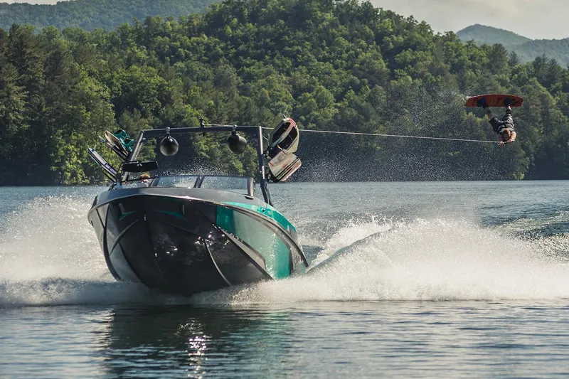 Slide: The Image of Manufacturer Provided Image: 2019 Axis T23 boat towing a wakeboarder on a scenic lake. - 53