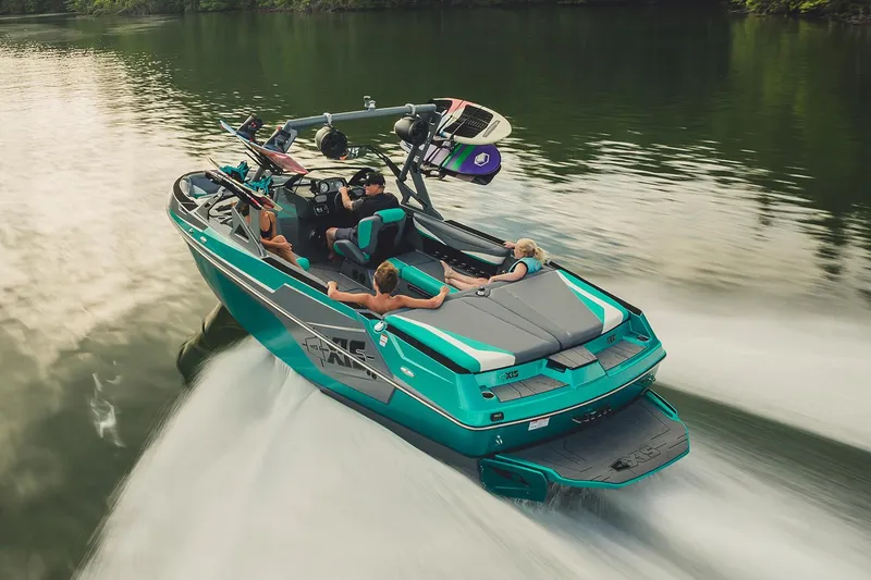 Slide: The Image of Manufacturer Provided Image: 2019 Axis T23 boat cruising on a lake with passengers and wakeboards. - 58