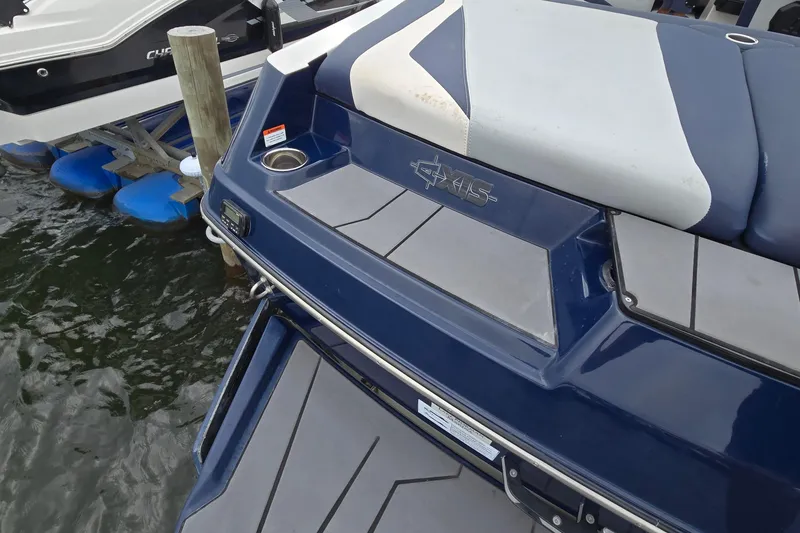 Slide: The Image of 2019 Axis T23 boat rear view with seating and cup holder. - 7