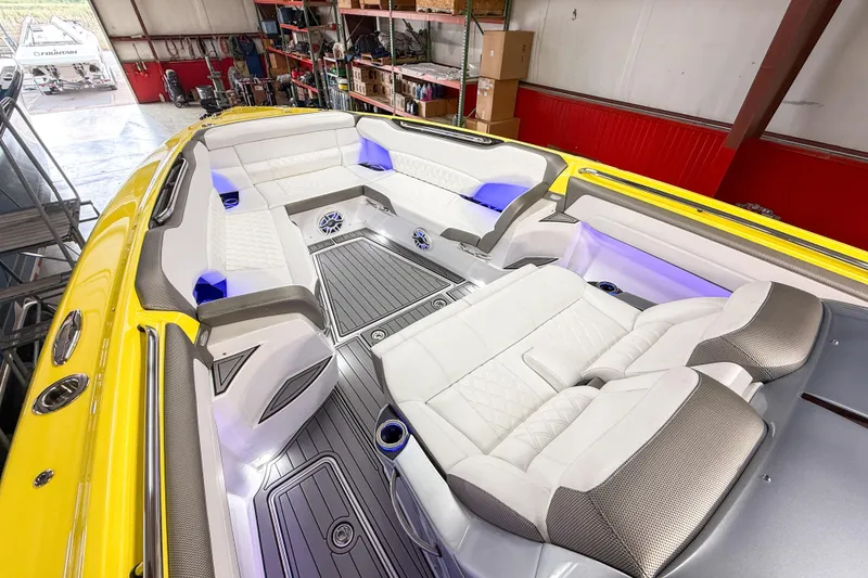 Slide: The Image of 2021 Nor-Tech 450 Sport boat interior with luxurious seating and ambient lighting. - 11