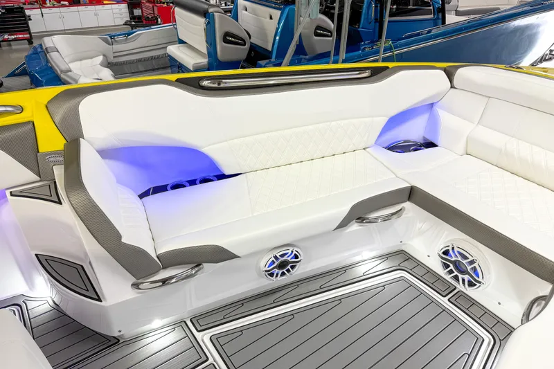 Slide: The Image of Luxurious seating area on a 2021 Nor-Tech 450 Sport boat with ambient lighting. - 12