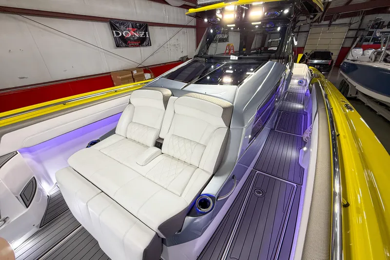 Slide: The Image of 2021 Nor-Tech 450 Sport boat interior with white seating and modern design. - 15