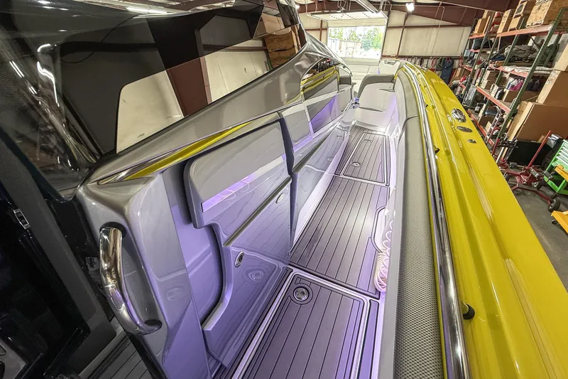 Slide: The Image of 2021 Nor-Tech 450 Sport boat interior with sleek design and vibrant lighting. - 20