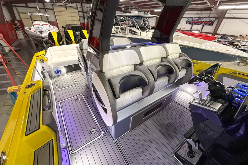 Slide: The Image of 2021 Nor-Tech 450 Sport boat interior with luxurious seating and modern controls. - 21