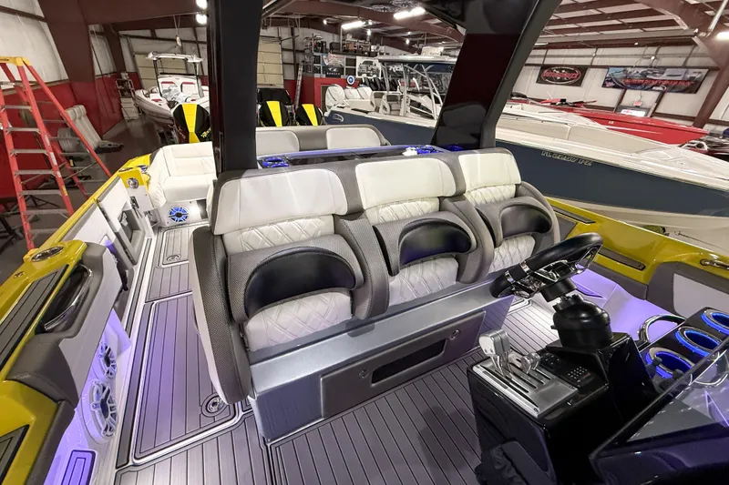 Slide: The Image of 2021 Nor-Tech 450 Sport boat interior with luxurious seating and modern controls. - 22