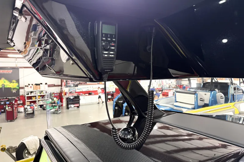 Slide: The Image of Interior of 2021 Nor-Tech 450 Sport boat with communication equipment in a workshop. - 24