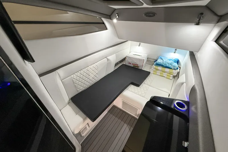 Slide: The Image of Luxurious interior of 2021 Nor-Tech 450 Sport boat with seating and storage. - 26