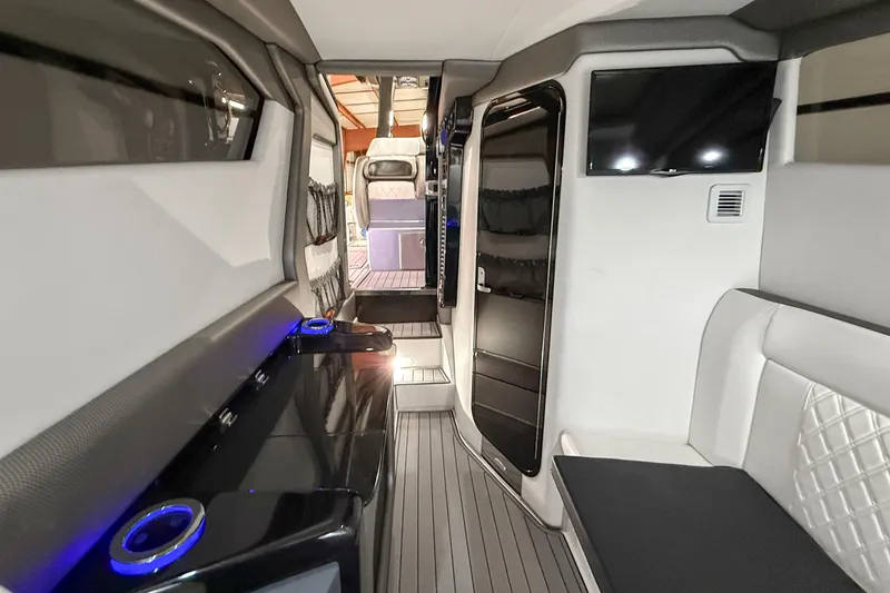Slide: The Image of Interior of 2021 Nor-Tech 450 Sport boat, featuring modern design and luxury amenities. - 27