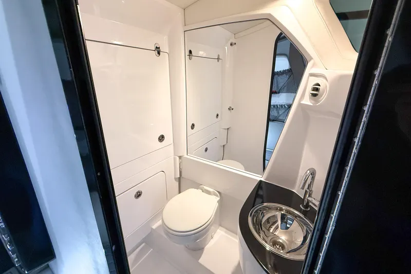 Slide: The Image of Luxurious bathroom in 2021 Nor-Tech 450 Sport boat with modern fixtures and sleek design. - 32