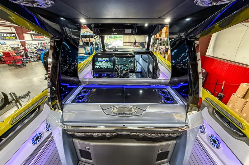 Slide: The Image of 2021 Nor-Tech 450 Sport boat interior with advanced dashboard and sleek design. - 37