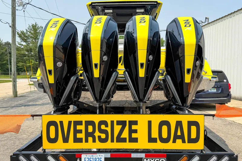 Slide: The Image of 2021 Nor-Tech 450 Sport boat with four powerful outboard engines, marked "Oversize Load." - 9