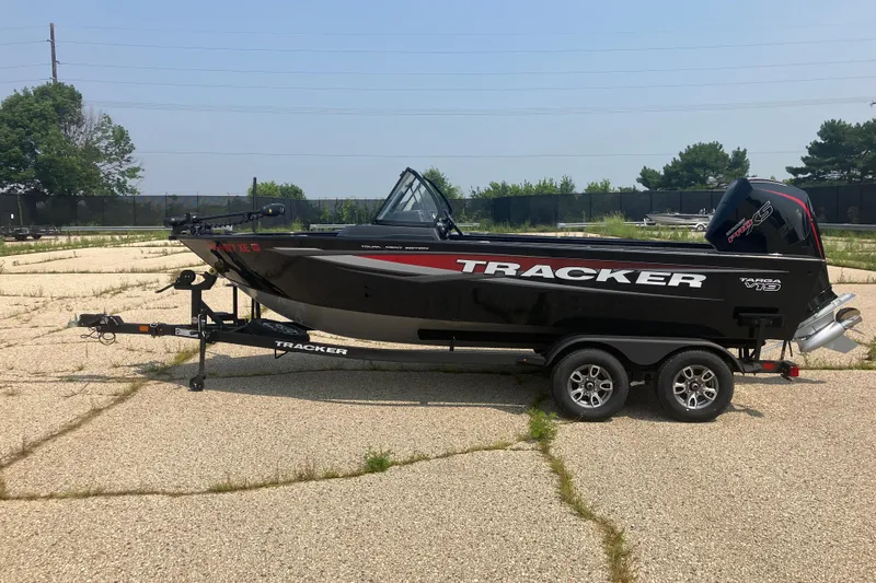 The Image of 2025 Tracker Targa V-19 Combo boat on trailer in outdoor setting. - 0