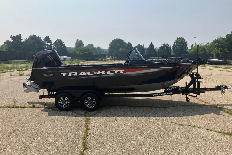 Slide: The Image of 2025 Tracker Targa V-19 Combo boat on trailer, parked outdoors. - 3