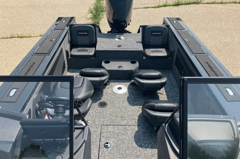 Slide: The Image of 2025 Tracker Targa V-19 Combo boat interior with seating and storage compartments. - 6