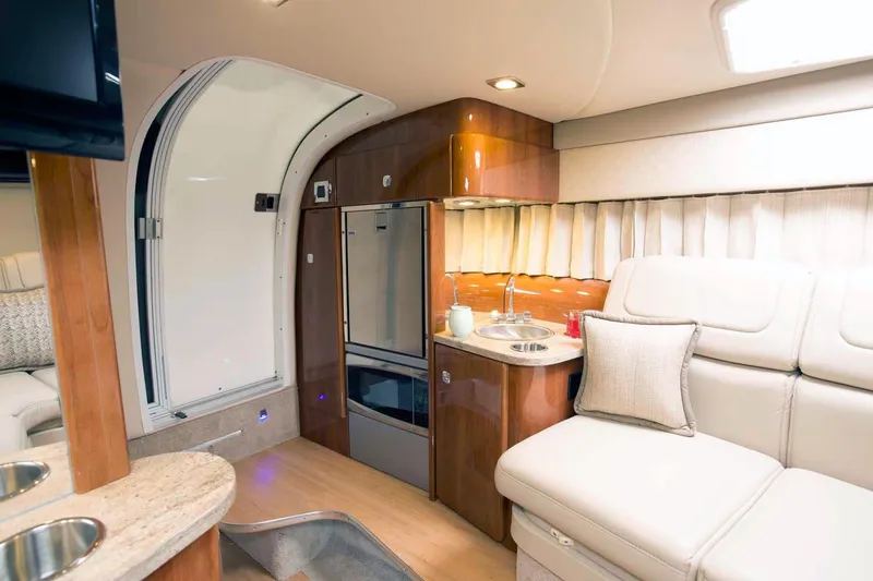 Slide: The Image of 2018 Formula 310 Sun Sport cabin with luxurious seating and dining area. - 23