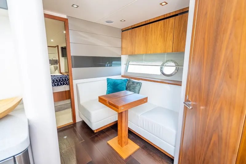 Slide: The Image of Luxurious interior of 2018 Sunseeker Predator 57 yacht with elegant seating and wooden accents. - 73