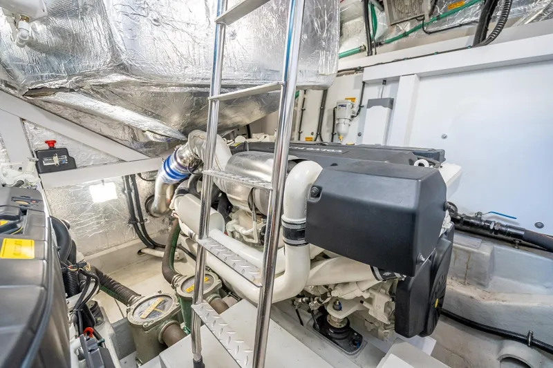 Slide: The Image of Engine room of 2018 Sunseeker Predator 57 yacht, featuring advanced machinery and equipment. - 90