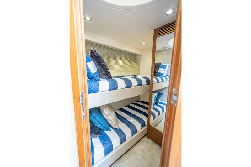 Slide: The Image of Bunk beds in 2018 Sunseeker Predator 57 yacht cabin with striped bedding. - 84