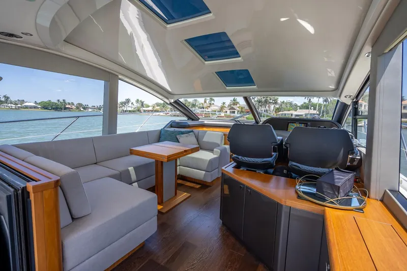 Slide: The Image of Luxurious interior of 2018 Sunseeker Predator 57 yacht with modern seating and panoramic windows. - 55