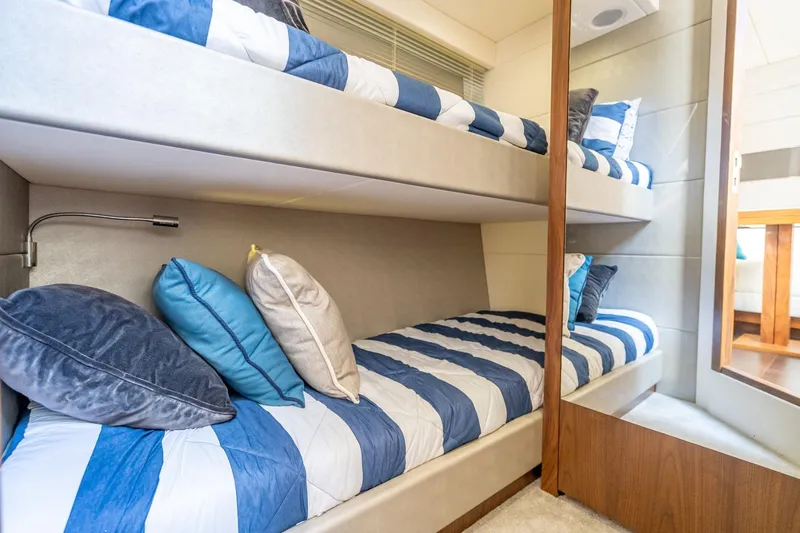 Slide: The Image of Bunk beds with striped bedding in 2018 Sunseeker Predator 57 yacht cabin. - 85