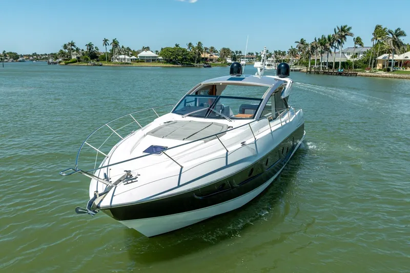 Slide: The Image of 2018 Sunseeker Predator 57 yacht cruising on a sunny day in a scenic waterway. - 23