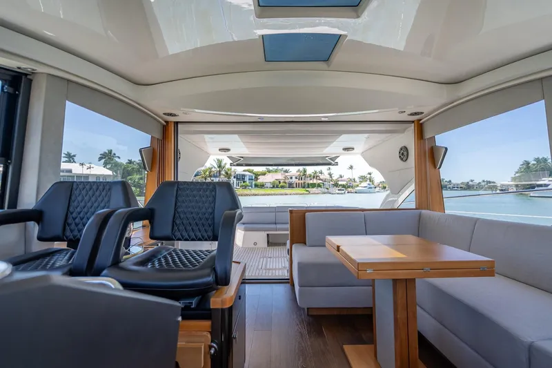 Slide: The Image of Luxurious interior of 2018 Sunseeker Predator 57 yacht with seating and scenic view. - 54