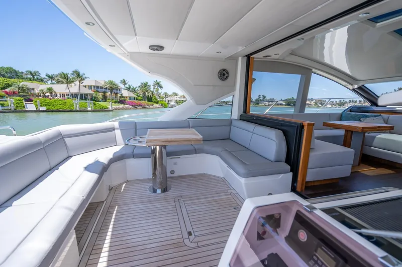 Slide: The Image of Luxurious 2018 Sunseeker Predator 57 yacht with spacious outdoor seating and scenic waterfront view. - 36
