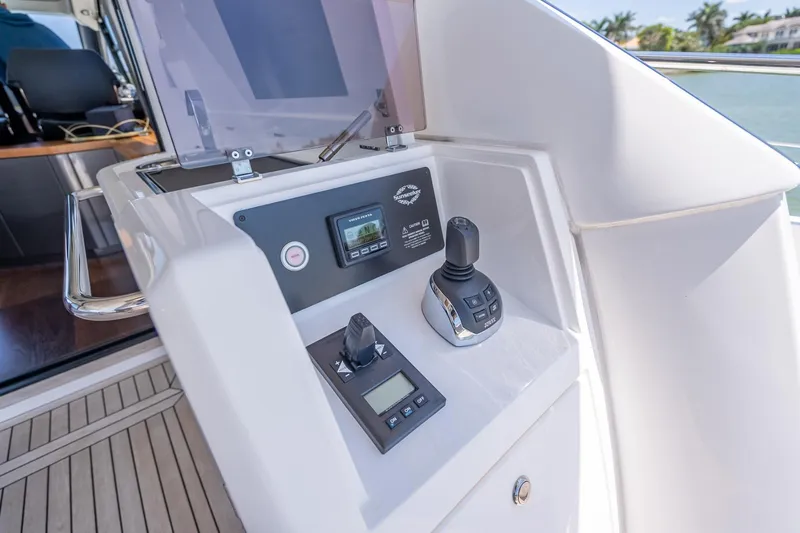 Slide: The Image of Control panel of a 2018 Sunseeker Predator 57 yacht, featuring navigation instruments. - 38