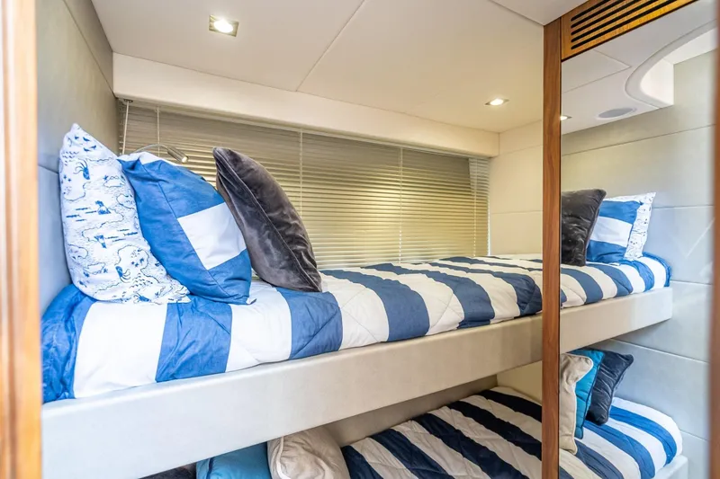 Slide: The Image of Bunk beds with striped bedding in 2018 Sunseeker Predator 57 yacht cabin. - 86