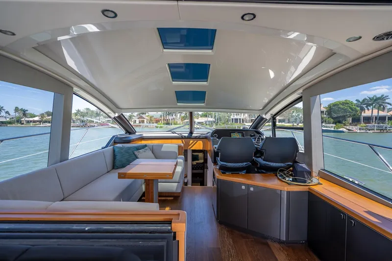 Slide: The Image of Luxurious interior of 2018 Sunseeker Predator 57 yacht with panoramic windows and modern seating. - 53